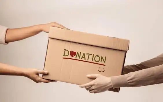 Volunteer with donation pack